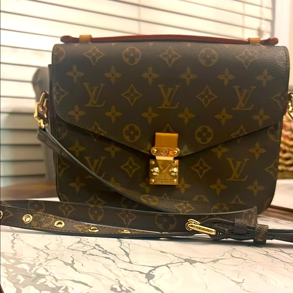 Leather crossbody bag . 10  by 7 .